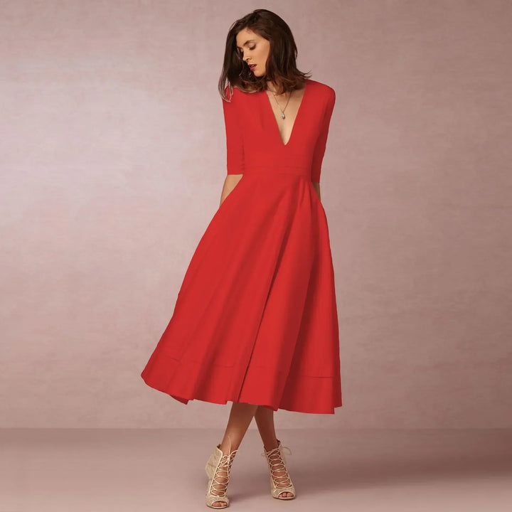Stylish elbow-sleeve midi dress with a flattering V-neck, embodying versatile women's fashion.