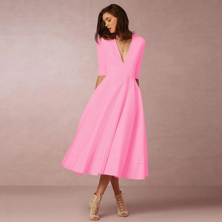 Comfortable purple V-neck midi dress with elbow sleeves, a versatile women's day to night fashion piece.