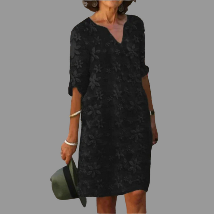 Women's versatile floral midi dress with a flattering V-neck and elbow sleeves, ideal for spring fashion.