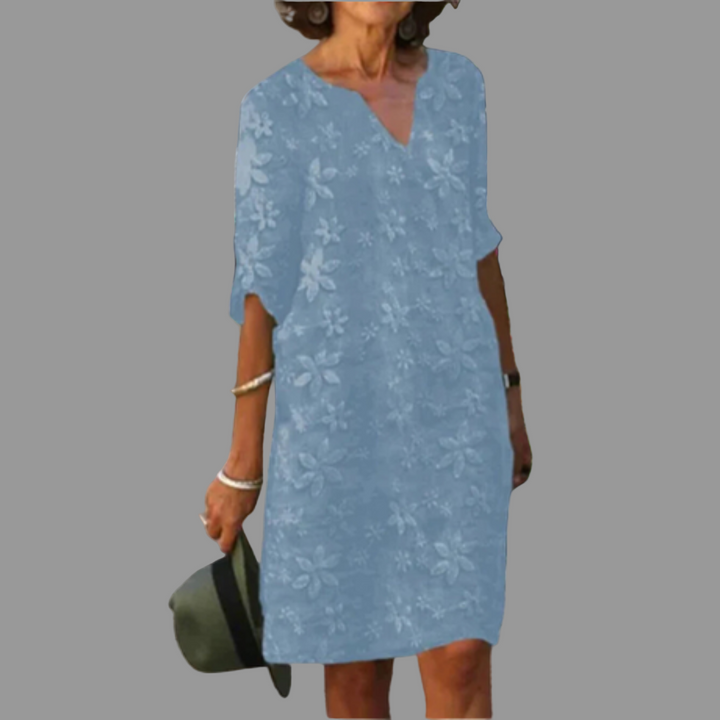 Modest women's elbow sleeve V-neck midi dress in a vibrant floral print, great for casual spring outfits.