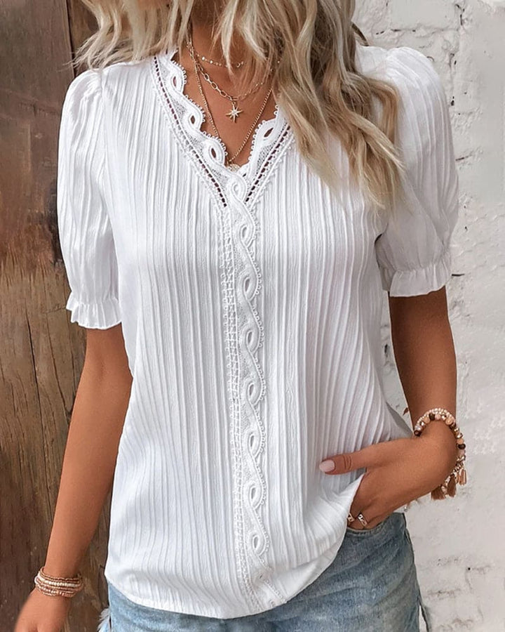Chic & versatile women's V-neck lace blouse. A sophisticated long sleeve top with delicate lace, suitable for casual or elegant looks.