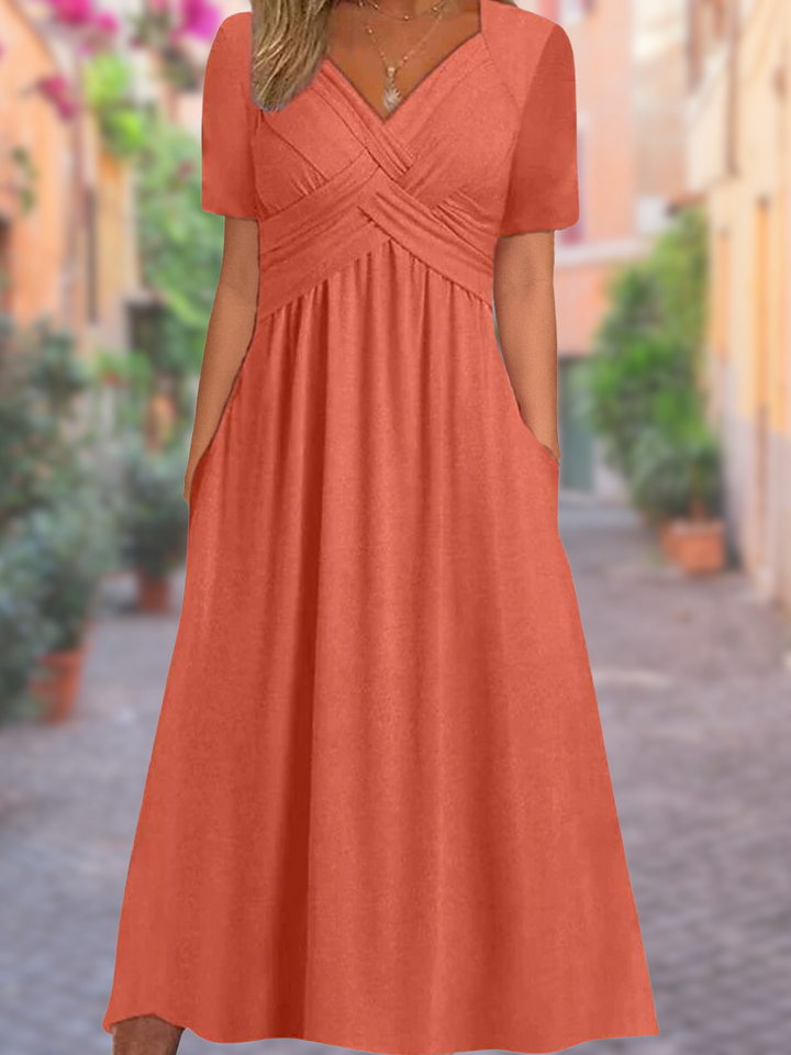Elegant women's V-neck midi dress with stylish crisscross detail, perfect for evening or spring fashion.