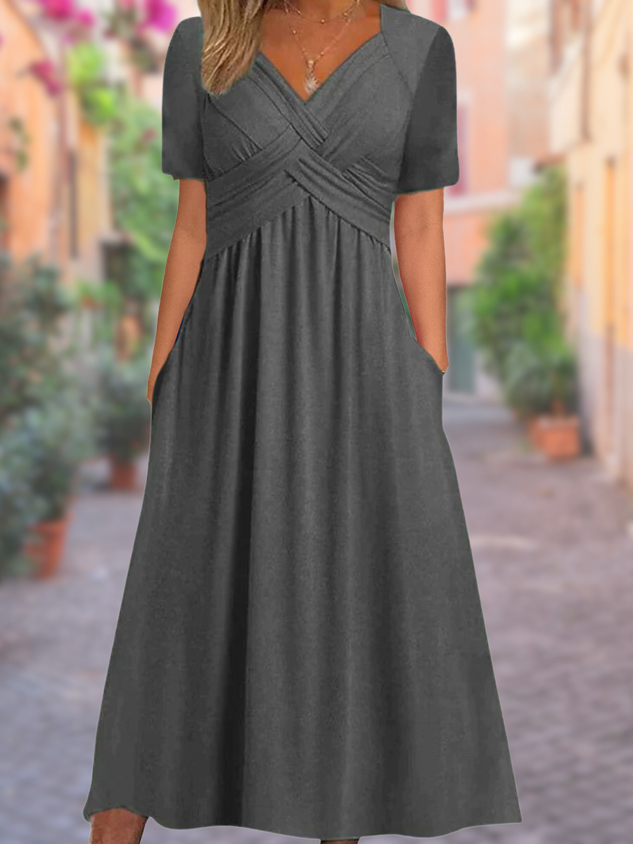 Women's fashion midi dress featuring a flattering V-neckline and chic crisscross bodice detail.