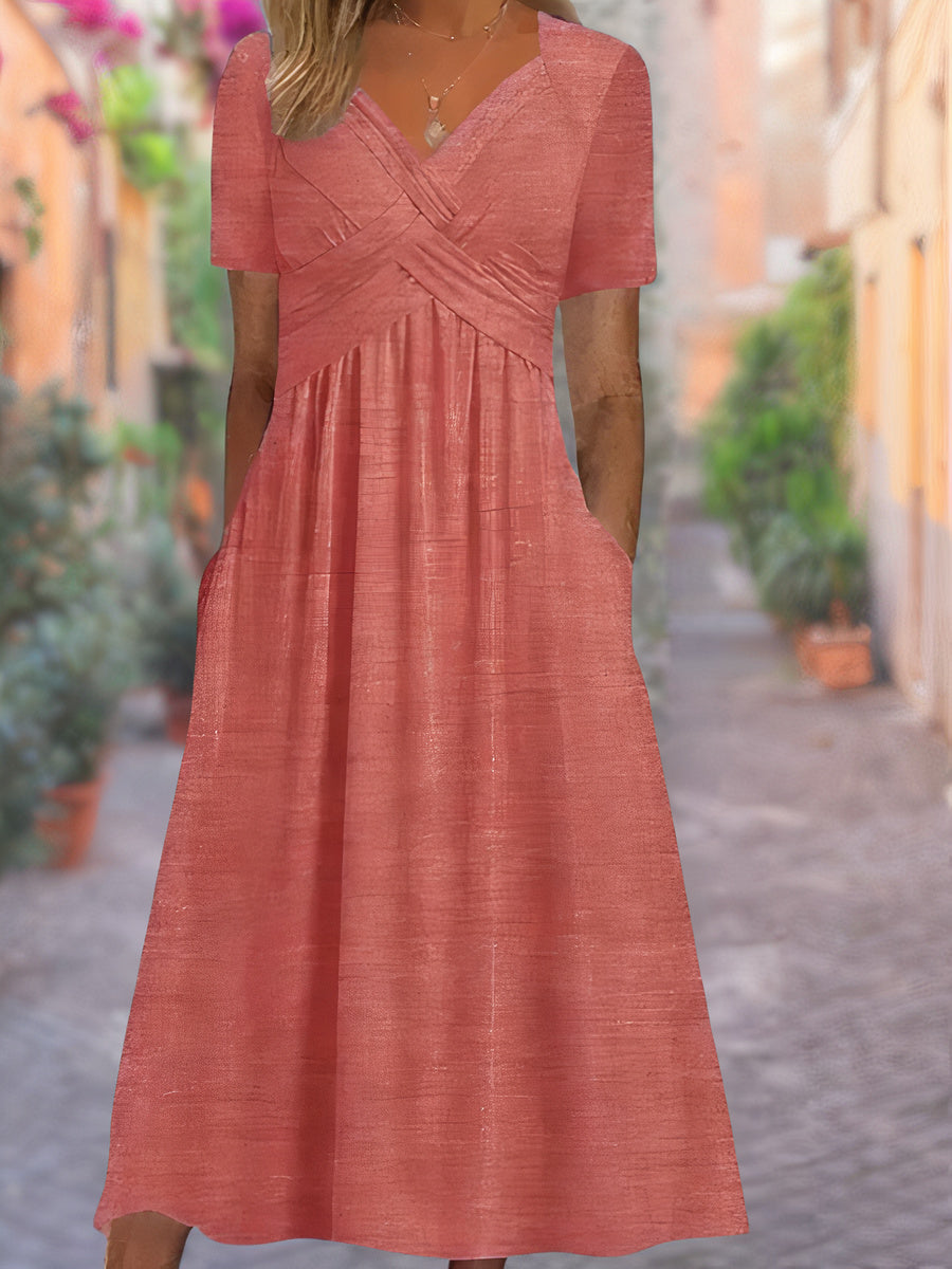 Stylish women's spring/summer midi dress with an elegant V-neck and unique crisscross design.