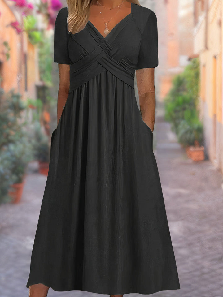 Sophisticated women's apparel: an elegant V-neck crisscross midi dress, ideal for any occasion.