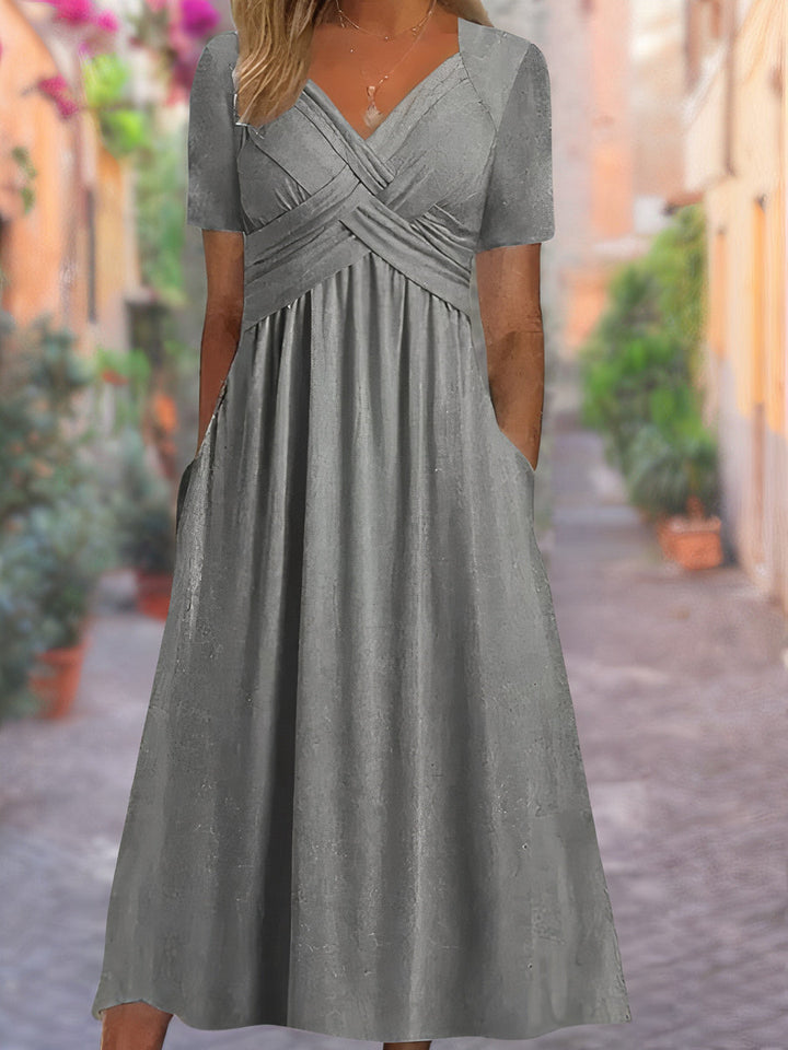 Chic women's midi dress featuring an elegant V-neck and fashionable crisscross design for your wardrobe.
