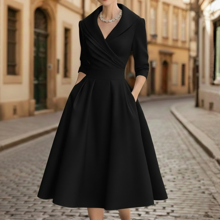 Sophisticated women's V-neck midi dress with 3/4 sleeves. Ideal elegant workwear or stylish occasion dress.