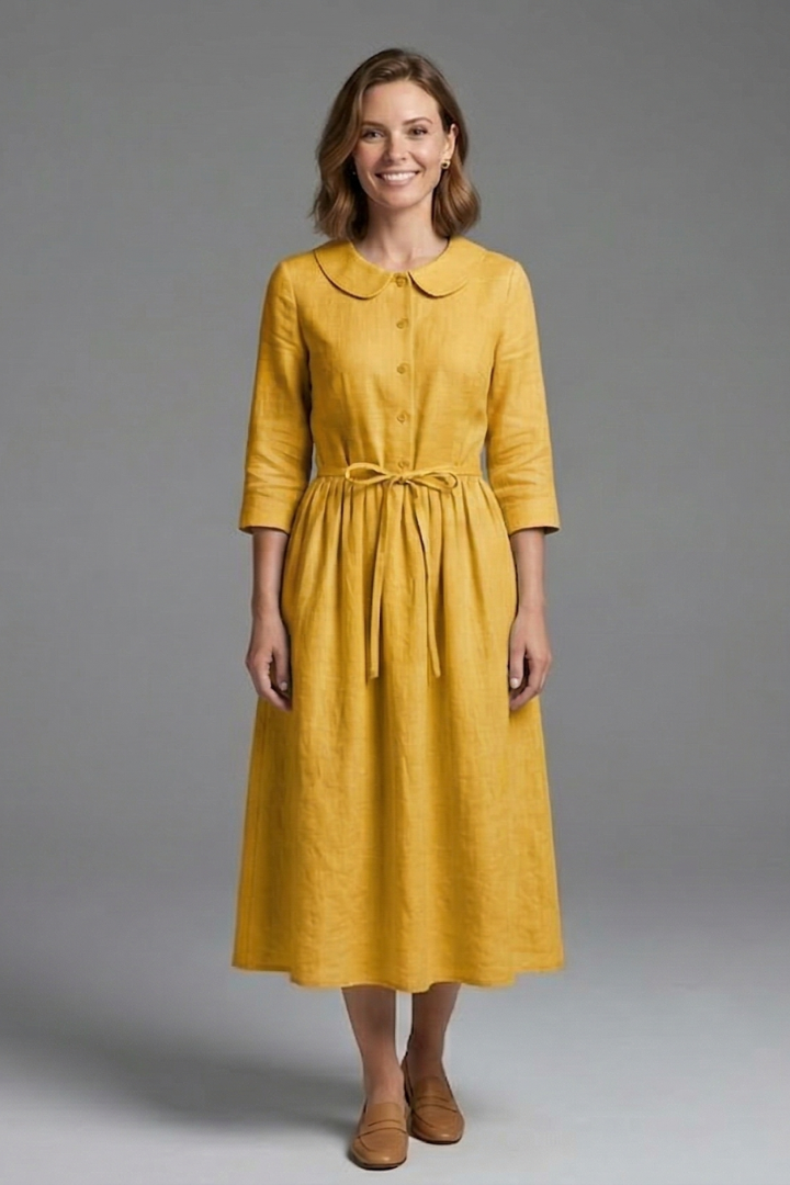 Model posing in chic V-neck midi dress with waist tie, versatile for casual, office, or evening.