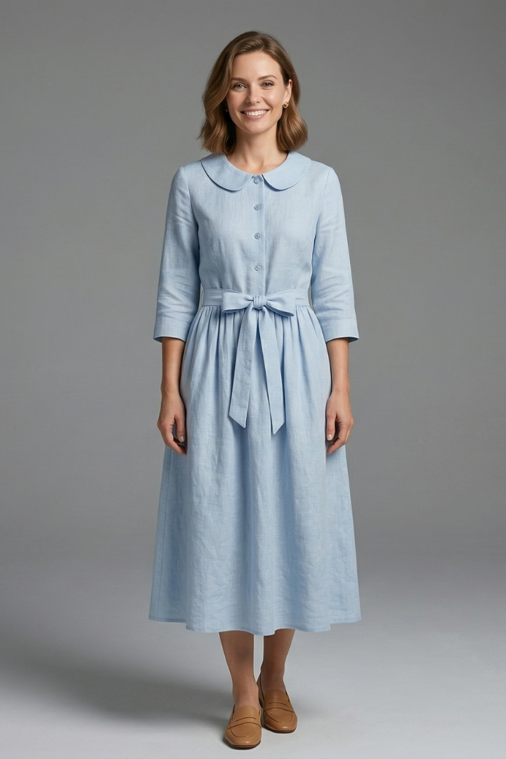 Close-up of flattering V-neckline on women's midi dress, enhancing elegant style.