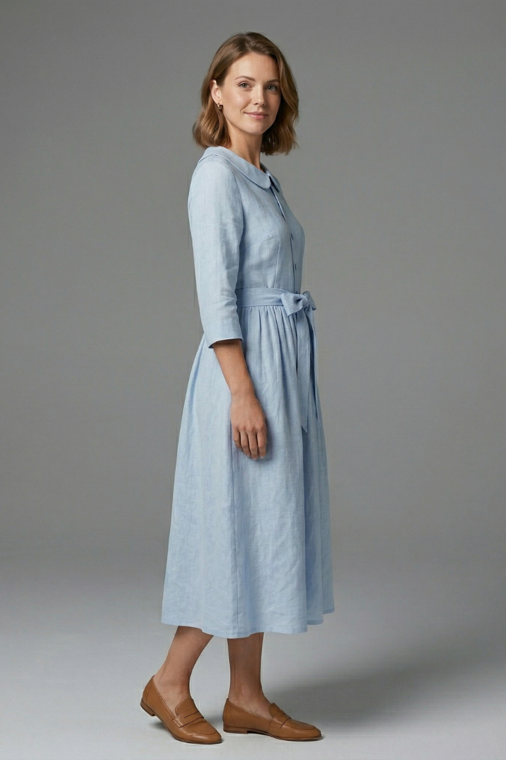 Side view of women's V-neck midi dress with waist tie, showcasing elegant & flattering silhouette.