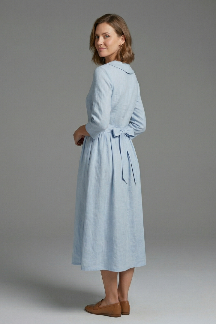 Back view of women's elegant midi dress, versatile for casual, office wear or evening events.