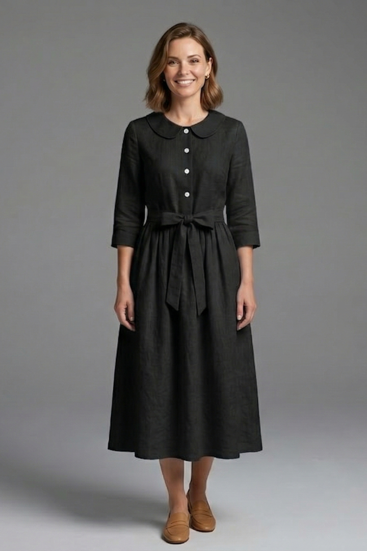 Woman in casual V-neck midi dress with waist tie, perfect for comfortable summer fashion.