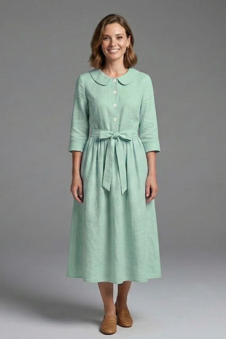 Fabric detail of women's V-neck midi dress, soft, comfortable, and elegant for spring style.