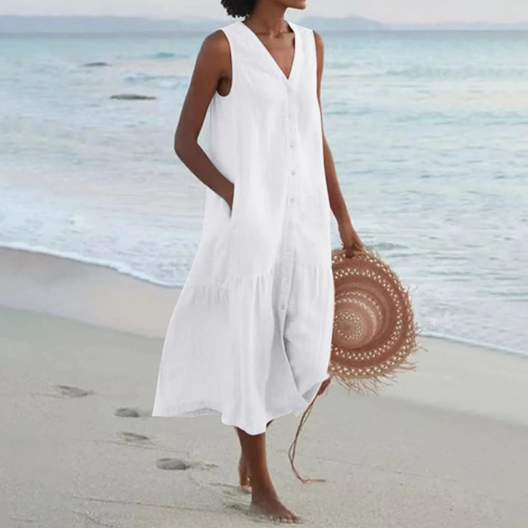 Elegant women's V-neck midi sundress, ideal for summer comfort & style. Flowing fabric, perfect for vacation wear.