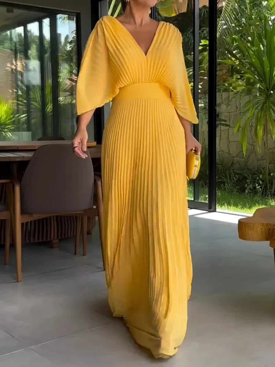 Elegant women's V-neck pleated kaftan maxi dress. Perfect flowy summer dress for any occasion.