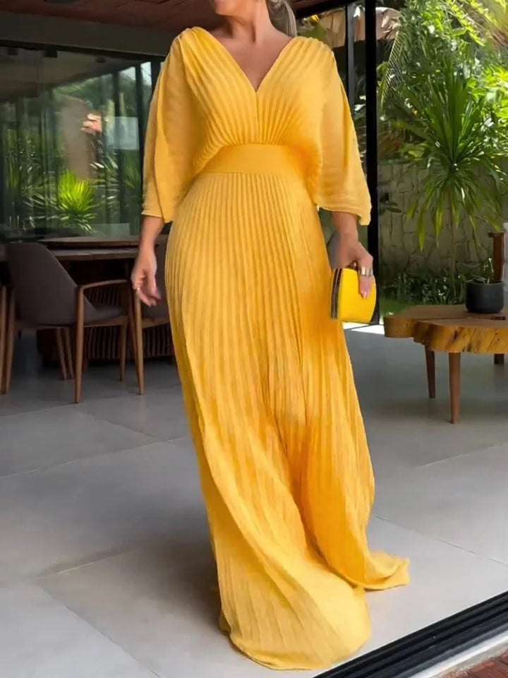 Chic women's long V-neck maxi dress with elegant pleats. Ideal kaftan style for summer fashion.