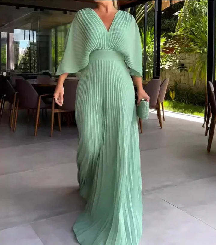 Flowy pleated kaftan maxi dress for women. Stylish V-neck design, perfect for elegant occasion wear.