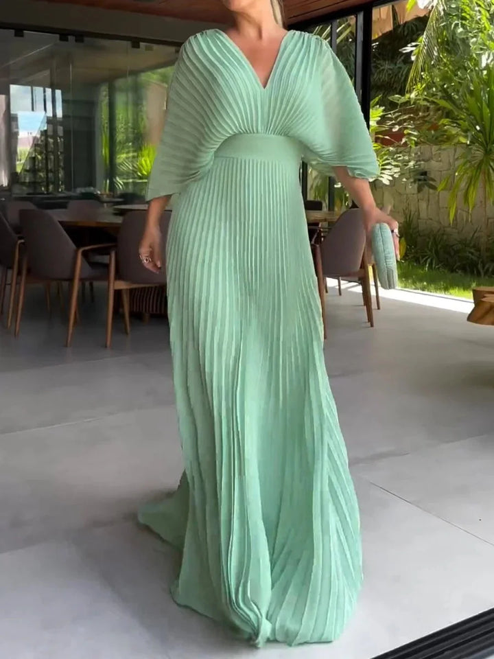 Beautiful women's elegant V-neck pleated maxi dress. Comfortable kaftan style, great for summer fashion.