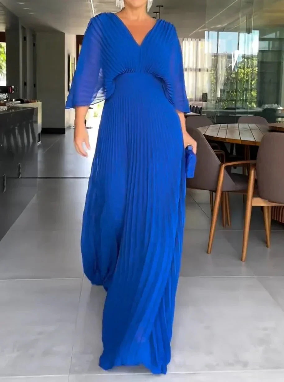 Women's elegant V-neck long kaftan dress with beautiful pleats. A versatile maxi for summer fashion.