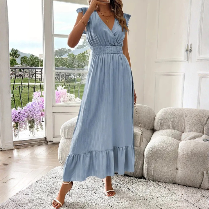Women's chic V-neck maxi dress with delicate ruffle trim, offering elegant flow and comfort for spring & summer fashion.