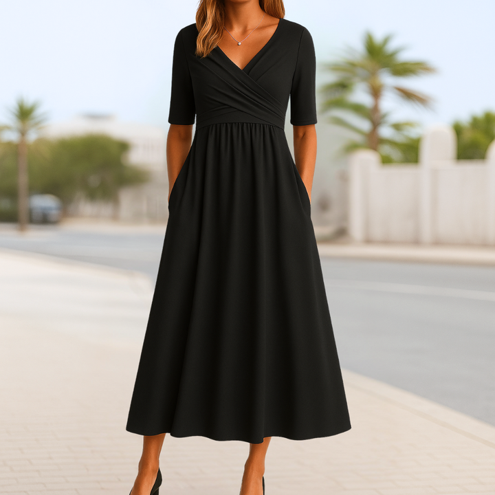 Flowy women's V-neck midi dress with short sleeves, featuring an elegant silhouette for spring fashion.