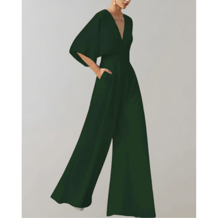 Flowing women's V-neck wide leg jumpsuit. A modern, elegant choice for party wear and formal events.