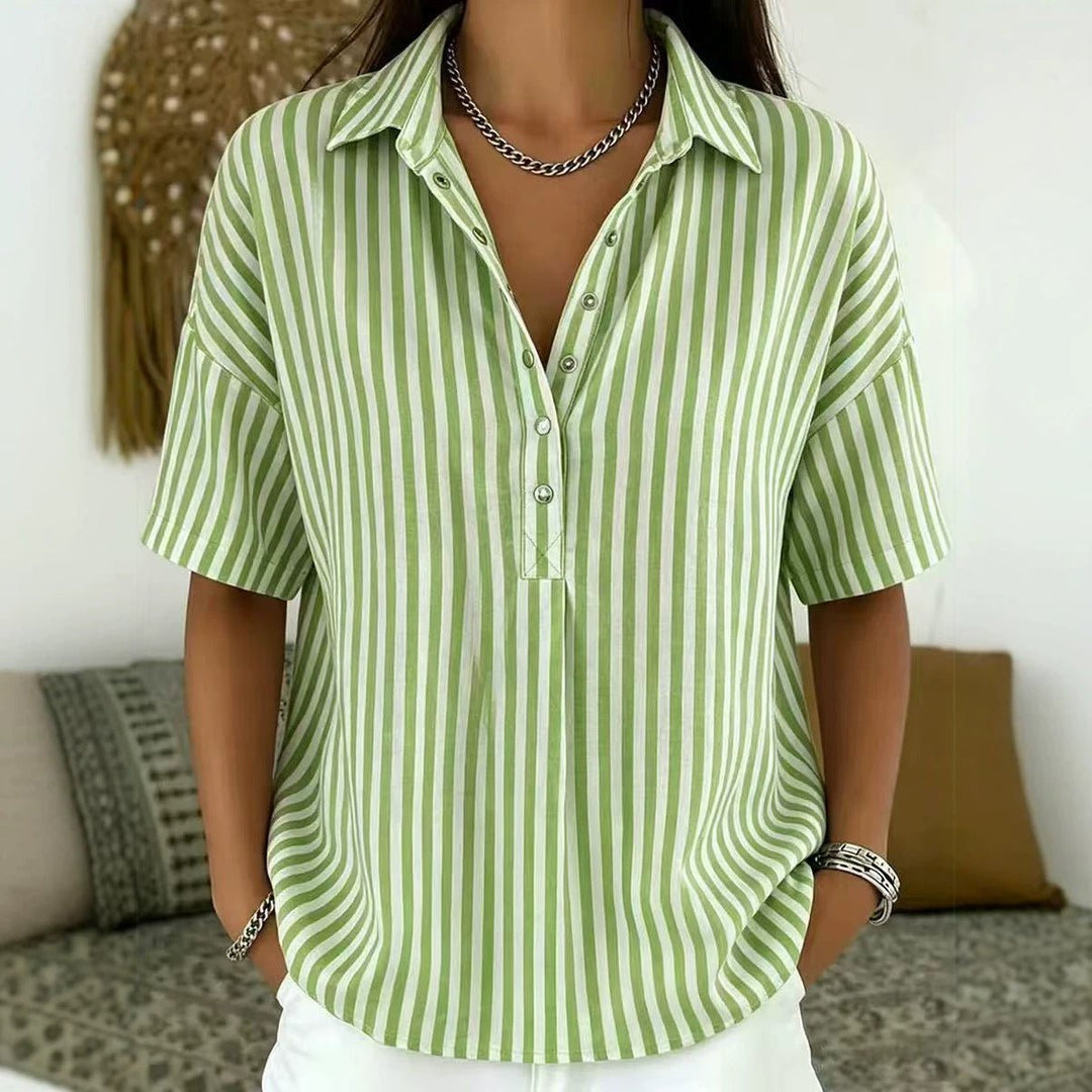 Stylish women's vertical stripe blouse with half-button front, a versatile top for summer fashion & office wear.