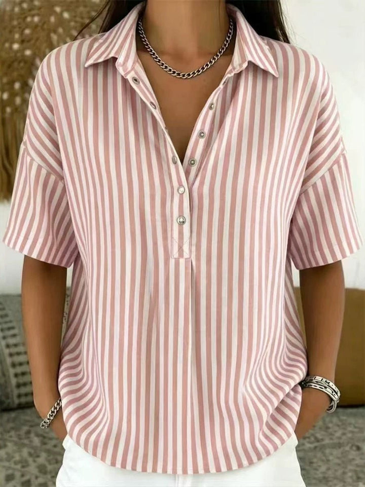 Relaxed fit women's blouse with elegant vertical stripes and half-button detail, a versatile stylish top.