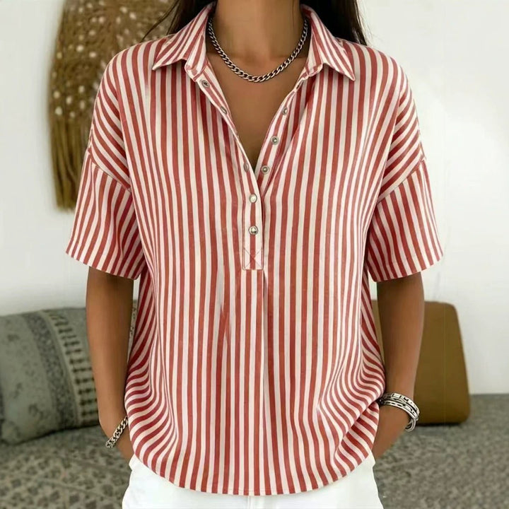 Women's half-button blouse featuring elegant vertical stripes, a perfect blend of casual & office chic.