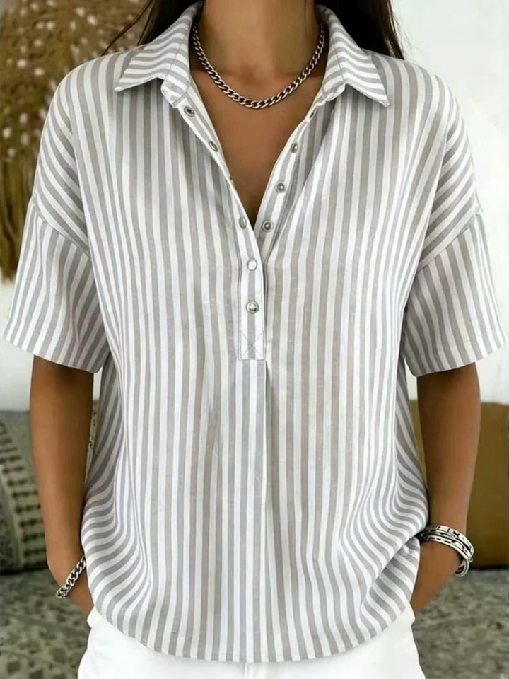 Chic women's vertical stripe half-button shirt, a relaxed fit top perfect for stylish casual or office wear.