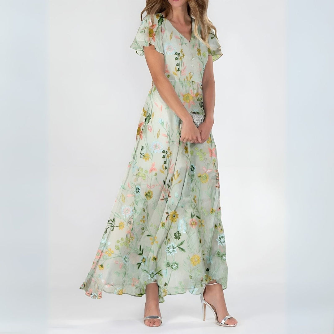 Long women's maxi dress featuring an elegant watercolor floral print, perfect for summer special occasions.