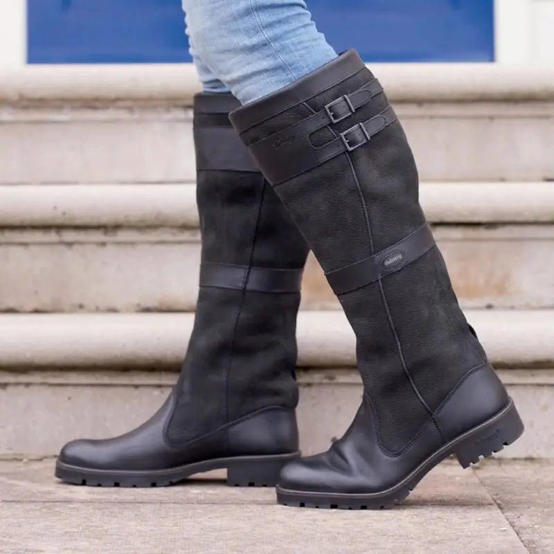 Women's waterproof knee-high rain boots for fall & winter. Comfortable pull-on design for elegant all-weather style.