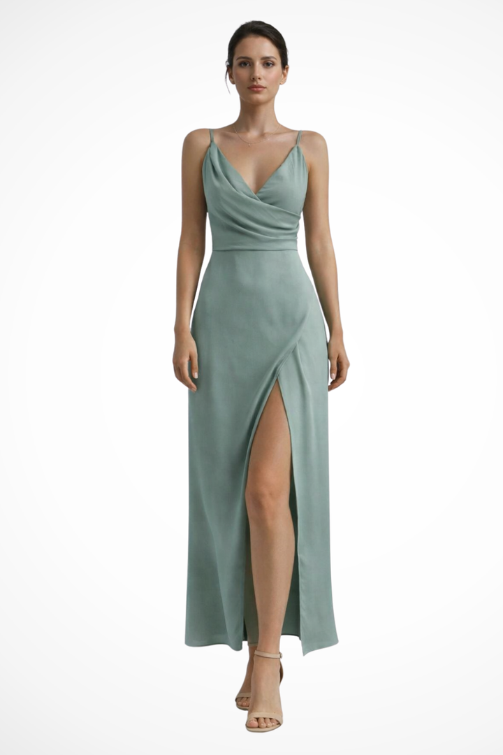 Women's elegant wedding guest slit maxi dress. Features a beautifully draped bodice & flowy long design for events.