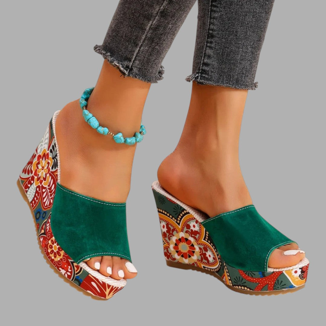 Classic black wedge sandals for women, an elegant choice for occasion wear. Comfortable and stylish.
