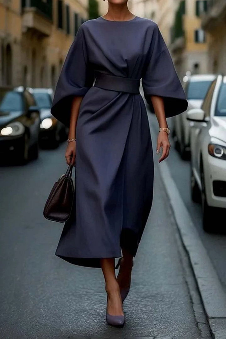 Sophisticated women's belted dress with unique lantern sleeves, ideal for special occasions.