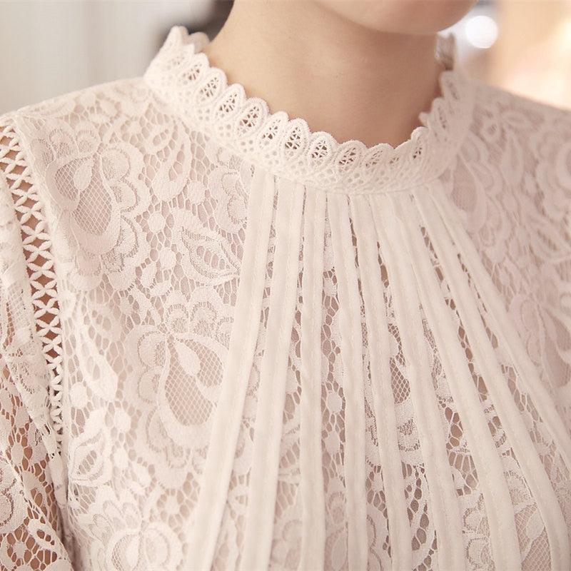 Feminine long sleeve lace blouse for women, featuring intricate floral pattern and elegant stand collar.