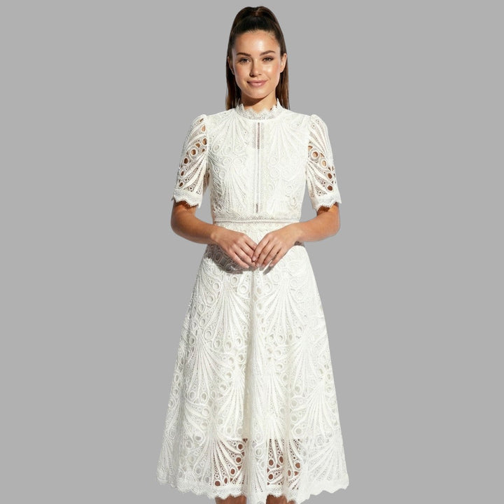 Sophisticated women's lace midi dress for special occasions. Features delicate lace overlay & flattering silhouette.