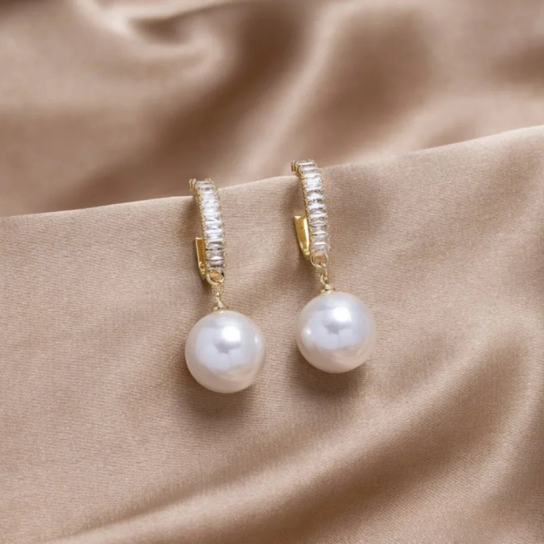 Elegant women's white pearl & sparkling zirconia drop earrings, perfect for special occasions and fashion jewelry.