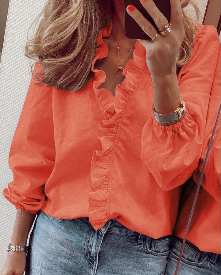Women's elegant ruffled V-neck blouse, long sleeve. A versatile and comfortable top for office or stylish casual wear.