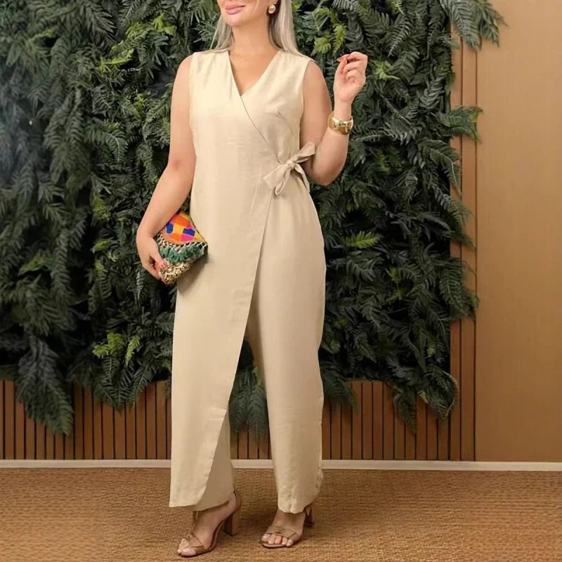 Chic sleeveless wide leg jumpsuit for women, featuring a wrap V-neck and belt, ideal for summer evenings or casual wear.