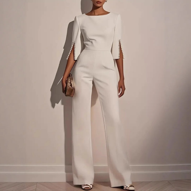 Elegant women's wide leg jumpsuit with exquisite pearl detailing, perfect for stylish spring and summer outfits.