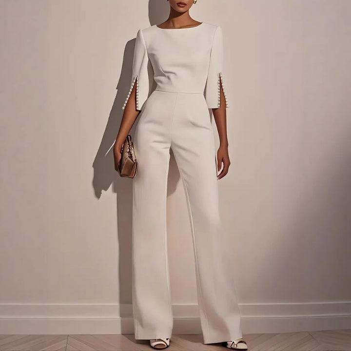 Elegant women's wide leg jumpsuit with exquisite pearl detailing, perfect for stylish spring and summer outfits.