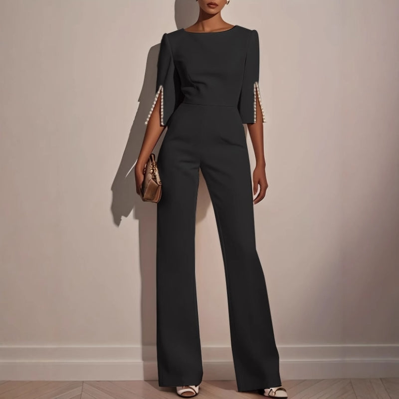 Fashionable wide leg jumpsuit for women, featuring chic pearl accents and a stylish, flowing silhouette.