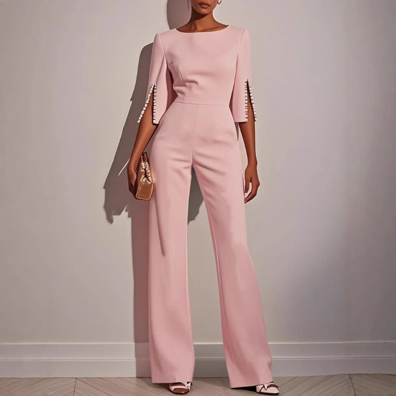 Women's elegant wide leg jumpsuit. Comfortable one-piece with sophisticated pearl detail for a fashionable look.