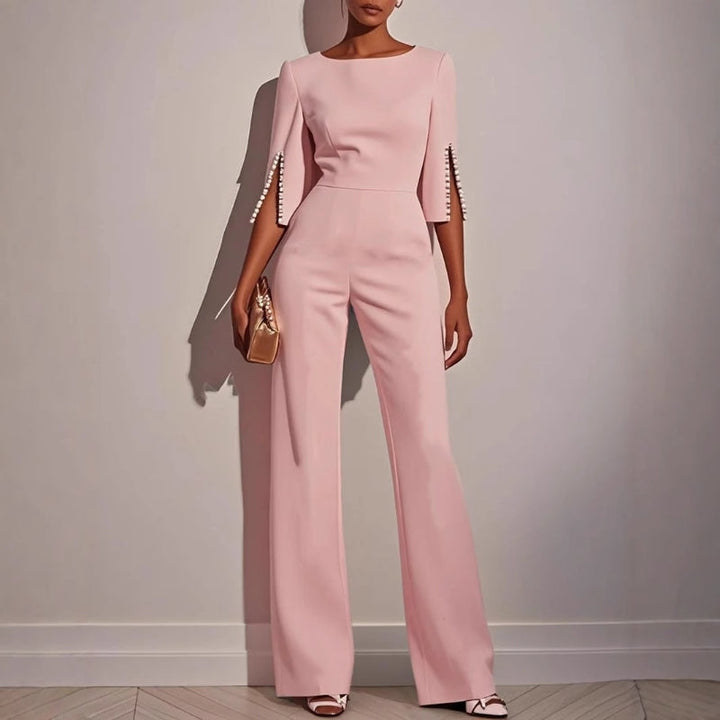 Women's elegant wide leg jumpsuit. Comfortable one-piece with sophisticated pearl detail for a fashionable look.