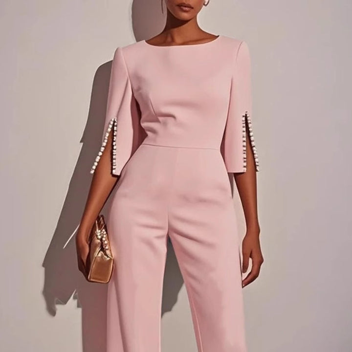 Women's wide leg jumpsuit. Flowy silhouette with delicate pearl detail, a comfortable and elegant one-piece.