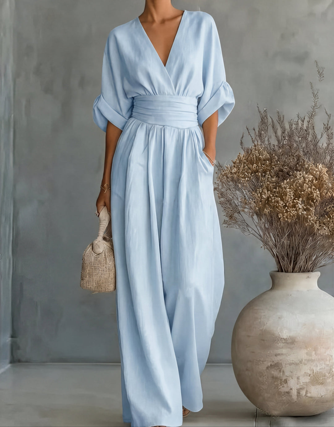 Women's comfortable wide-leg wrap jumpsuit, a fashionable one-piece for formal or casual elegance.
