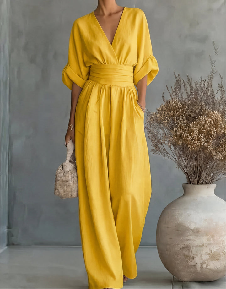 Formal women's wide-leg jumpsuit, featuring an elegant wrap front, ideal for parties & evening wear.
