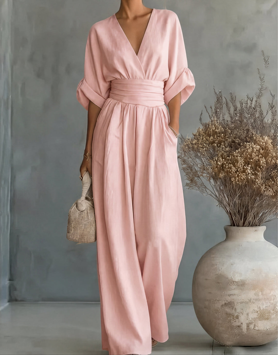 Women's one-piece wide-leg wrap jumpsuit, an elegant and comfortable option for formal or party wear.