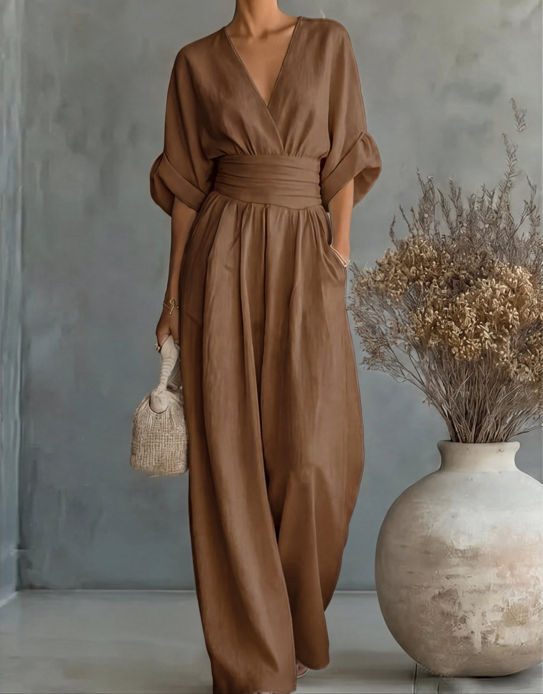 Elegant women's wide-leg wrap jumpsuit for parties, a comfortable and chic one-piece evening wear.